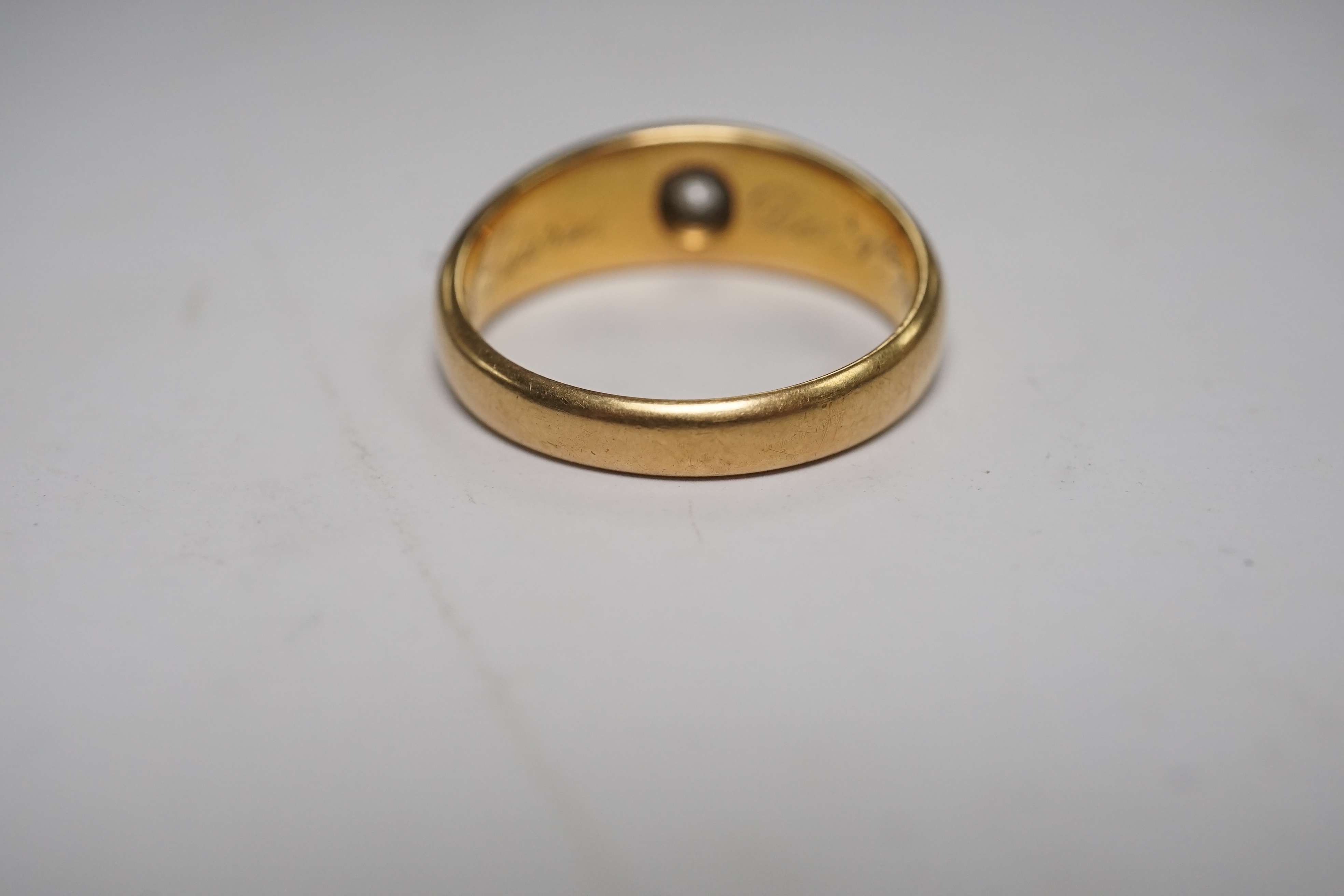 A late Victorian 18ct gold and gypsy set solitaire diamond ring, size Q/R, gross weight 7.7 grams. Condition - fair to good